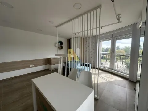 Living room with a dining table and access to the terrace. - image 2