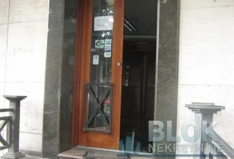 Building entrance door with a stone frame. - image 6