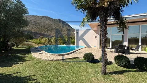 House yard with a swimming pool, terrace, and hill view. - image 3