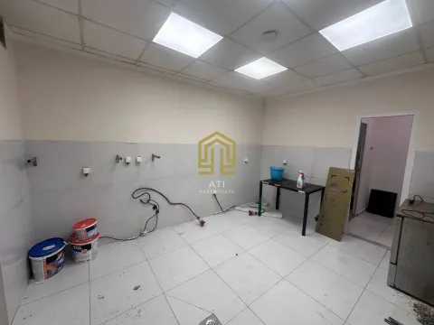 An empty room under renovation with tiled floor and walls. - image 4