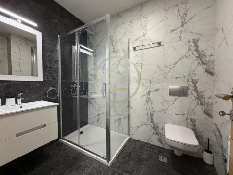 Modern bathroom with a shower cabin, washbasin and built-in sanitaryware. - image 14