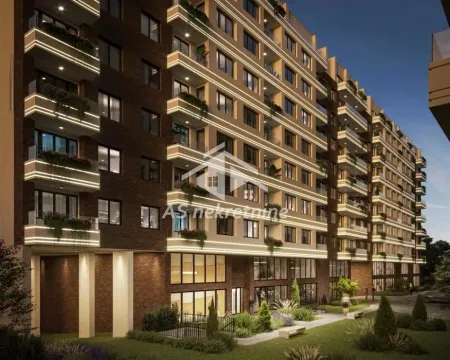 View of the illuminated residential building facade with landscaped courtyard at night. - image 5