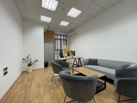 Office space with a seating set and a desk. - image 35