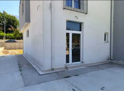 Exterior of a modern two-story house with an entrance door and paved yard. - image 5