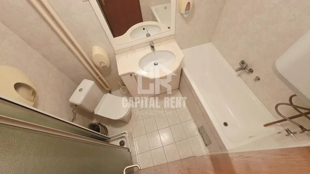 High-angle view of a bathroom equipped with a bathtub, washbasin, and toilet.