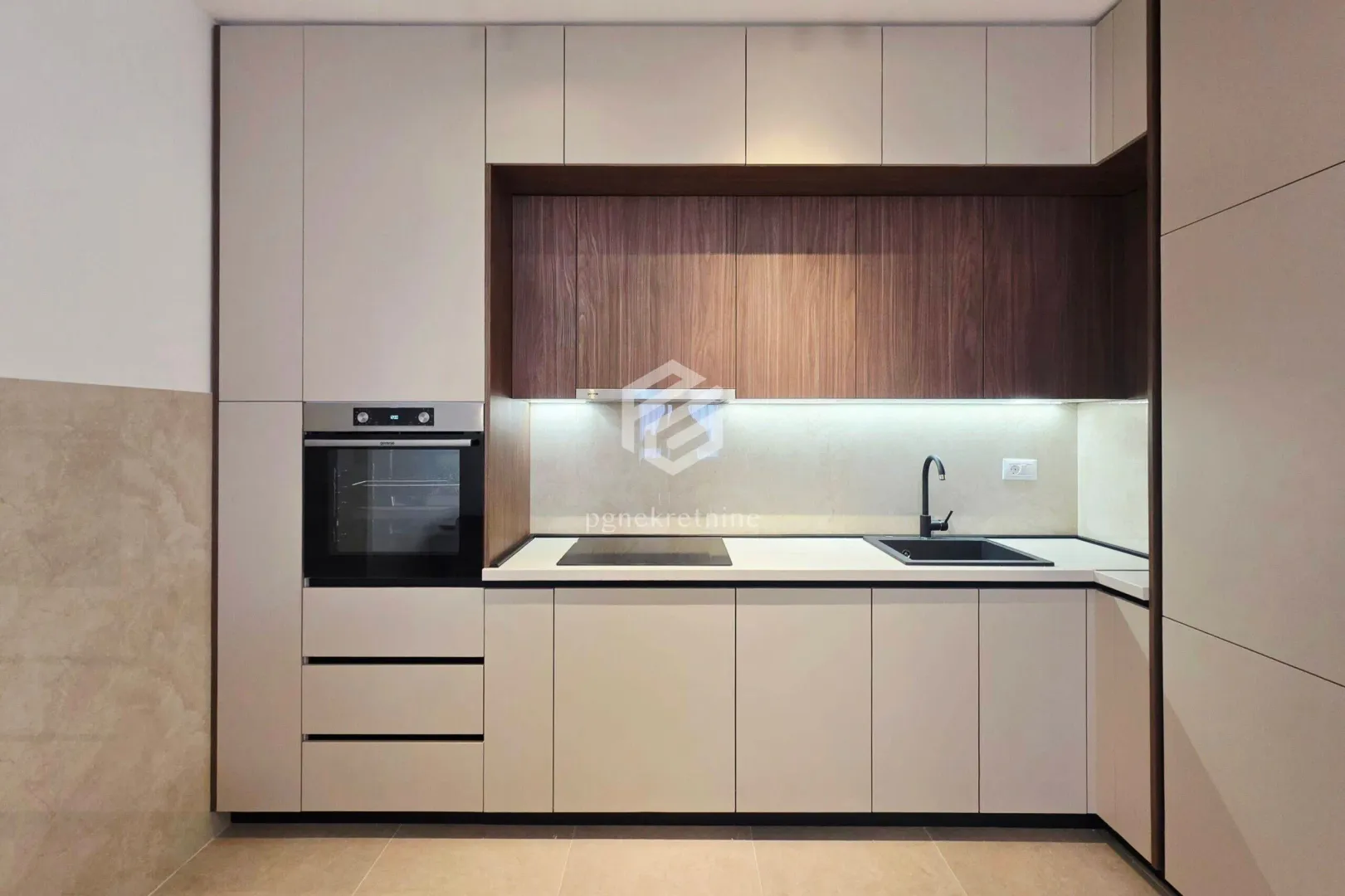 Modern kitchen with built-in cabinetry and a white countertop.