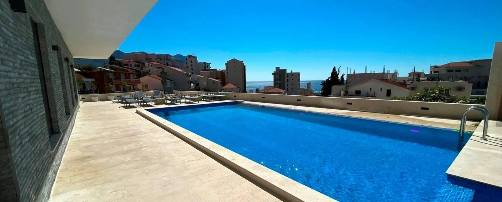 View of the outdoor swimming pool and surrounding buildings.