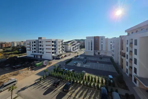 View of the buildings and parking lot in front of the residential complex. - image 5