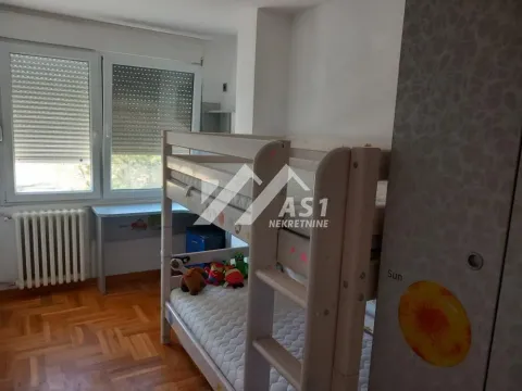 Children's bedroom with a bunk bed and a window. - image 7