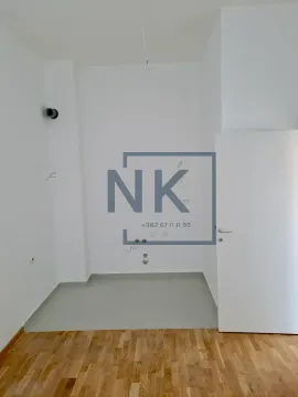 Empty room with white walls and a wooden floor. - image 3