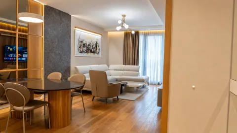Living room with a dining area and modern furniture. - image 2