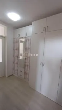 Bedroom with a large built-in wardrobe and a mirror. - image 9