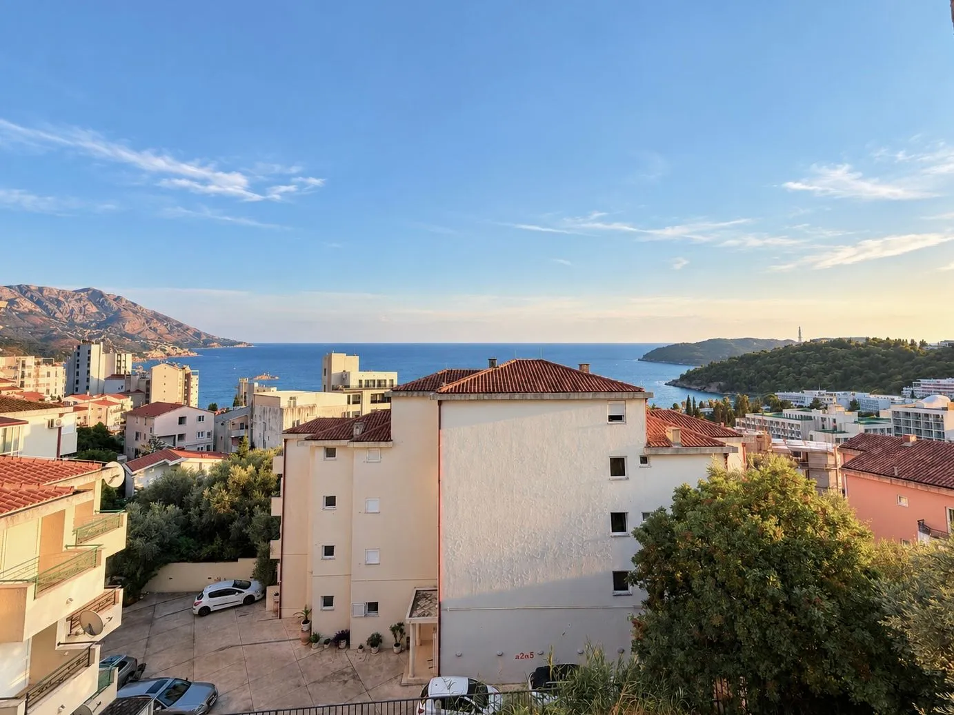 View of the sea and surrounding buildings from the property terrace.