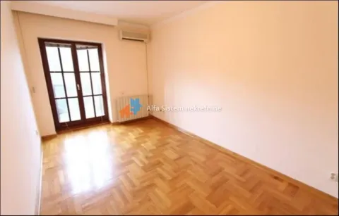 Empty room with hardwood flooring and balcony doors. - image 16