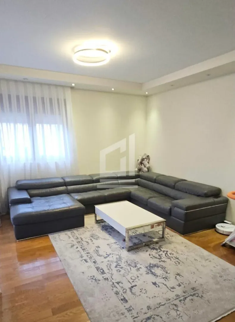 Living room with a sectional sofa and coffee table.