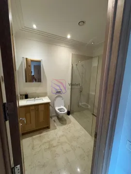 Modernly equipped bathroom with a washbasin, toilet, and walk-in shower. - image 14