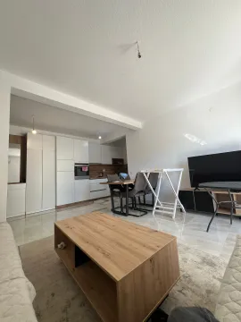 Living room with dining area and kitchen in the background. - image 11