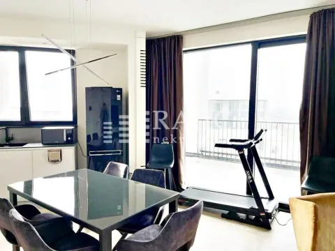 Spacious living room with a dining area, kitchen, and access to the terrace. - image 6