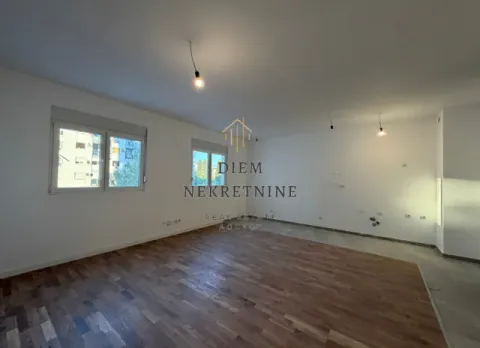 Empty room with parquet flooring and white walls. - image 4