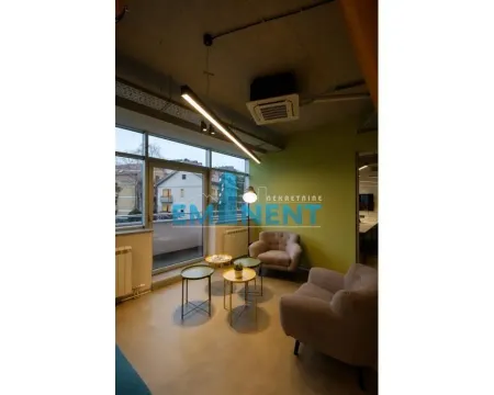 Living room with seating furniture, small tables, and access to the terrace. - image 3