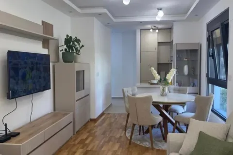 Living room with dining area and kitchen in the background. - image 7