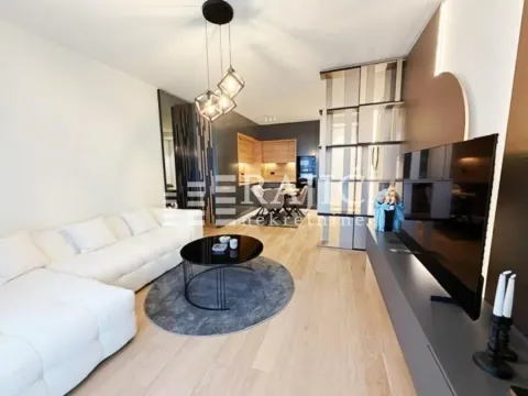 Modern and bright living room with a sofa and dining area in the background. - image 7