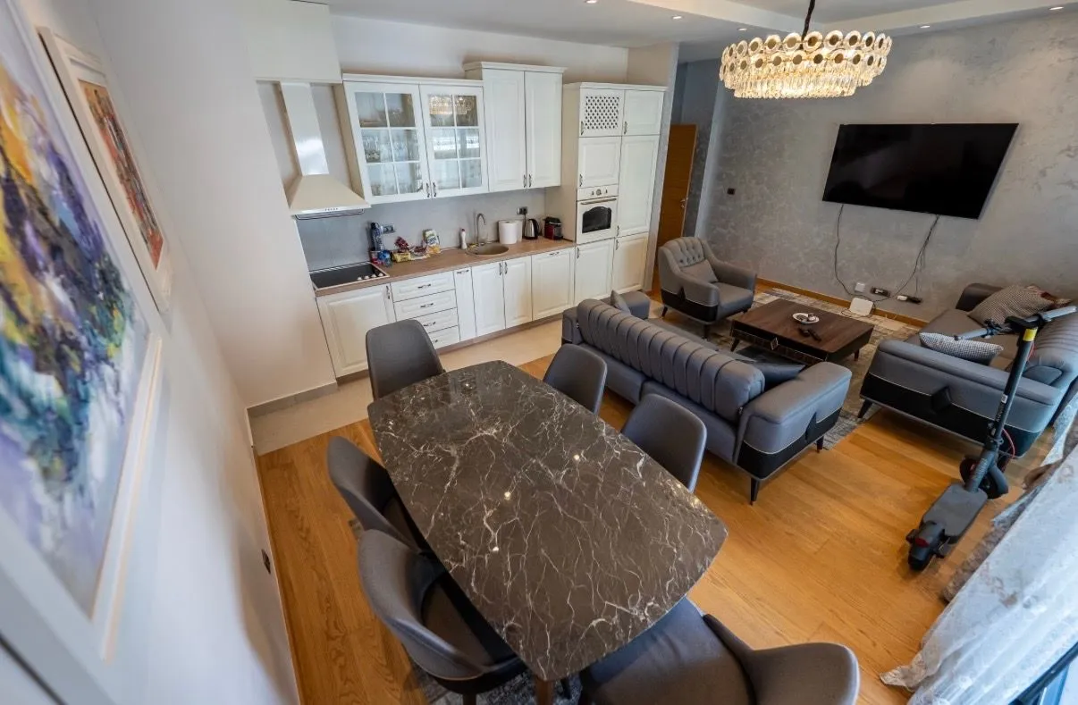 Spacious living room with dining area and kitchen.
