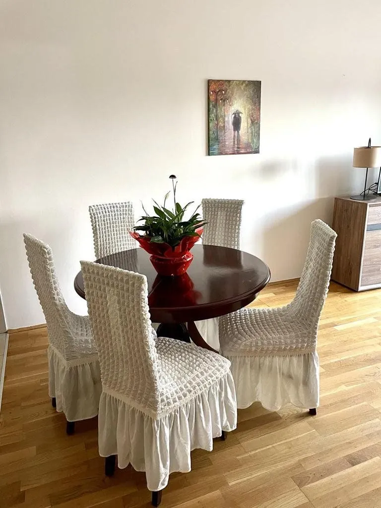 Dining table with chairs in the living room.