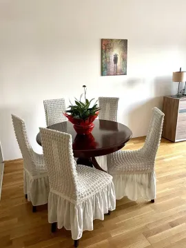 Dining table with chairs in the living room. - image 4