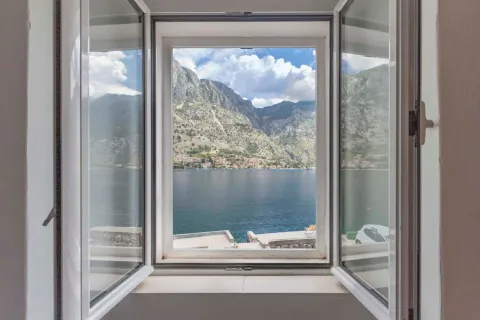 View of the sea and mountains through an open window. - image 17