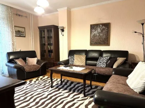 Furnished living room with seating set and coffee table. - image 2