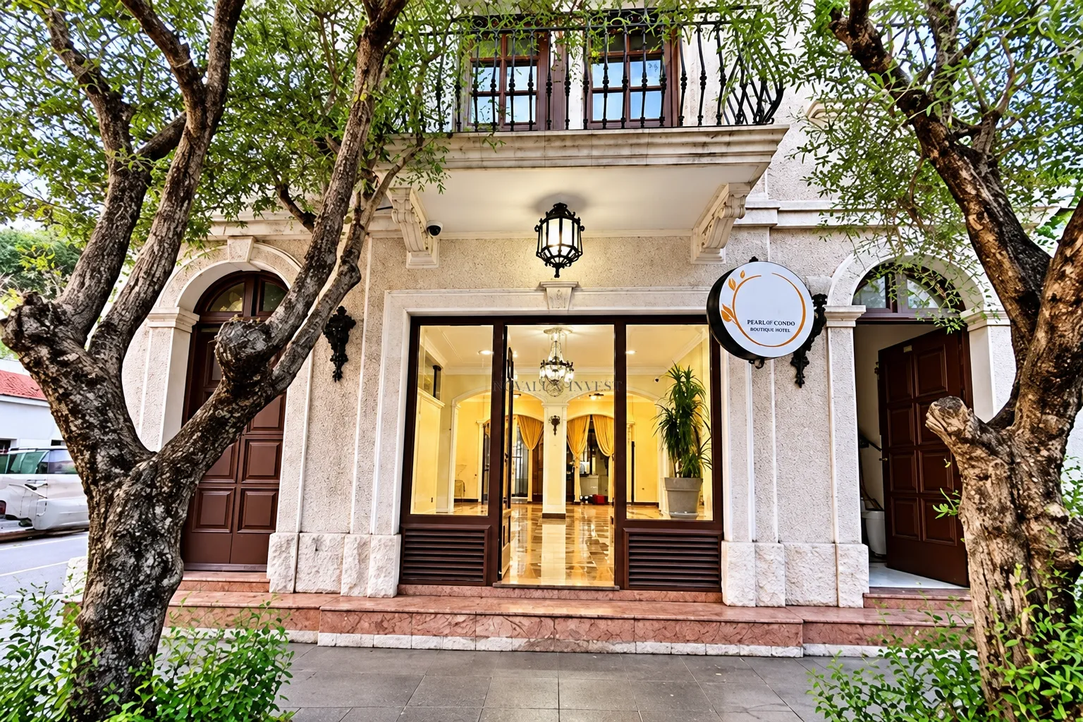 Main entrance and building facade with trees in front.