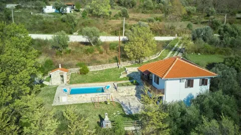 Aerial view of a house with a swimming pool and a spacious yard. - image 2