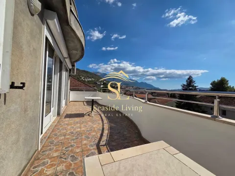 Spacious balcony with a view of the surroundings and mountains. - image 16