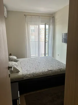 Bedroom with a double bed and access to the terrace. - image 5