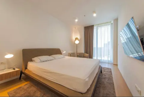 Modern bedroom with a double bed, TV, and access to the terrace. - image 8