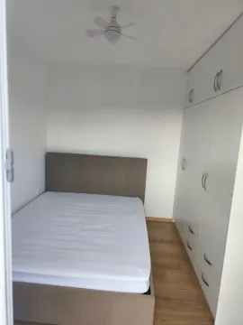 Bedroom with a double bed and built-in wardrobe. - image 8