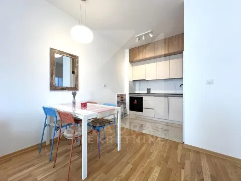 Kitchen with dining area and wooden flooring. - image 4