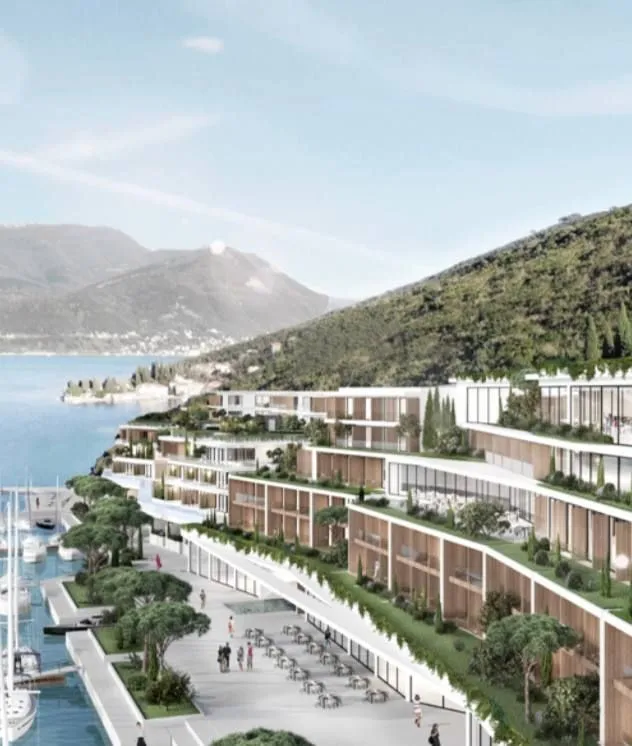 Spoljašnji izgled modernog stambenog kompleksa sa terasama i pogledom na more.