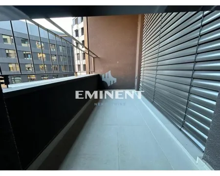 Covered terrace with a metal railing and a view of neighboring buildings. - image 17