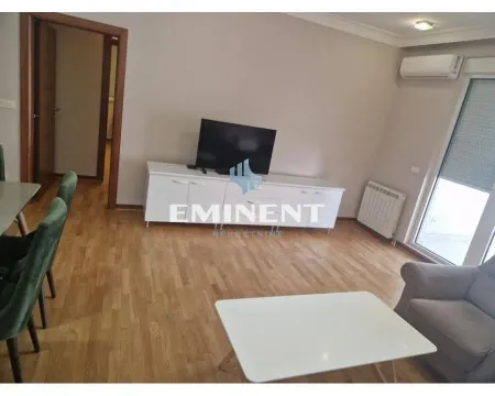 Living room with furniture, television and dining table. - image 3