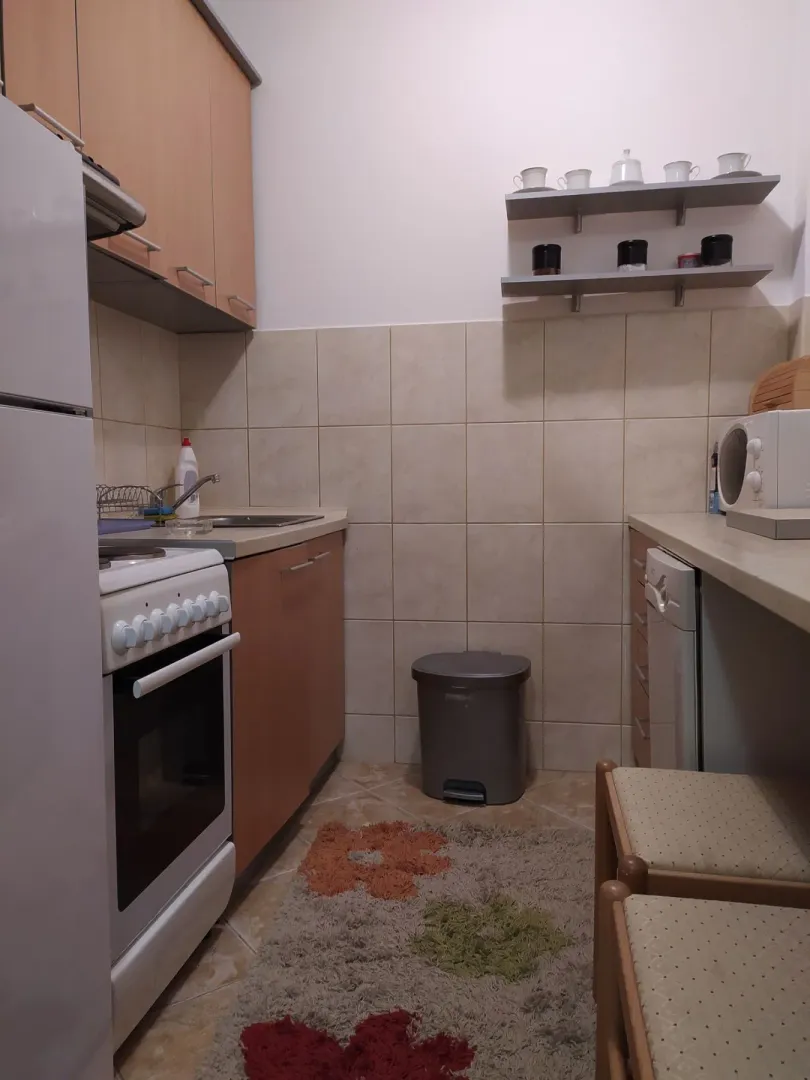 A small, functional kitchen with cabinets and appliances.