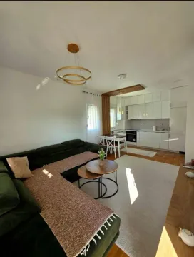 Living room connected with dining area and kitchen. - image 2
