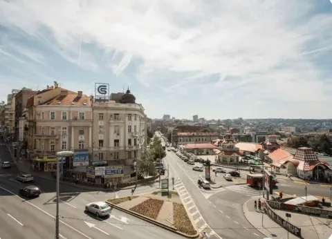 View from the window of the city street and surrounding buildings. - image 3