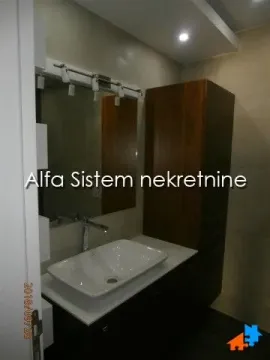 Bathroom with a sink and a mirror. - image 21