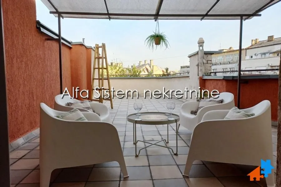 Spacious rooftop terrace furnished with outdoor seating.