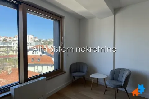 Living room with a large window and city view. - image 13