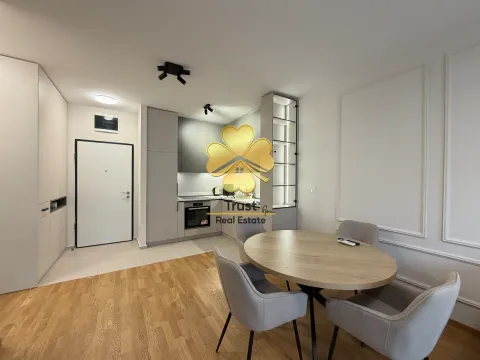 Modern living room with a dining area and a built-in kitchen. - image 3