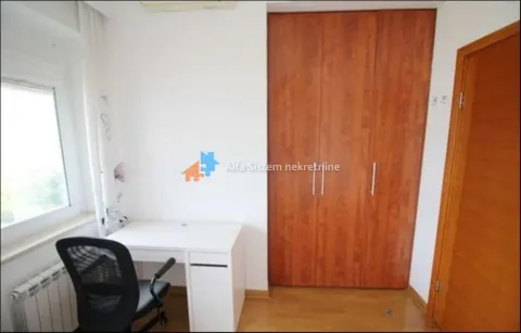 Small room with a desk and a fitted wardrobe. - image 25