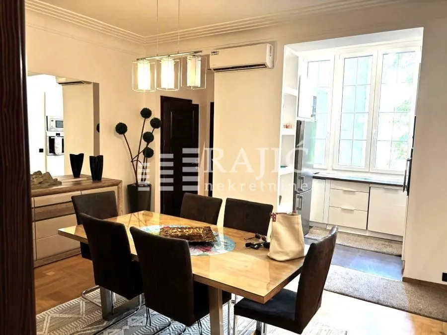 Spacious dining area connected to the living room and kitchen.